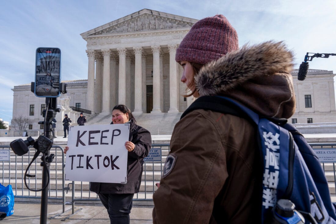 Person protests TikTok ban at Supreme Court with a visible ‘Keep TikTok’ sign.