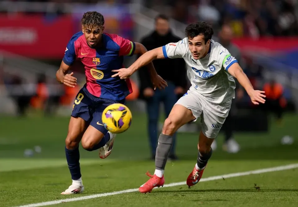 Lamine Yamal weaving past multiple defenders in a Champions League fixture