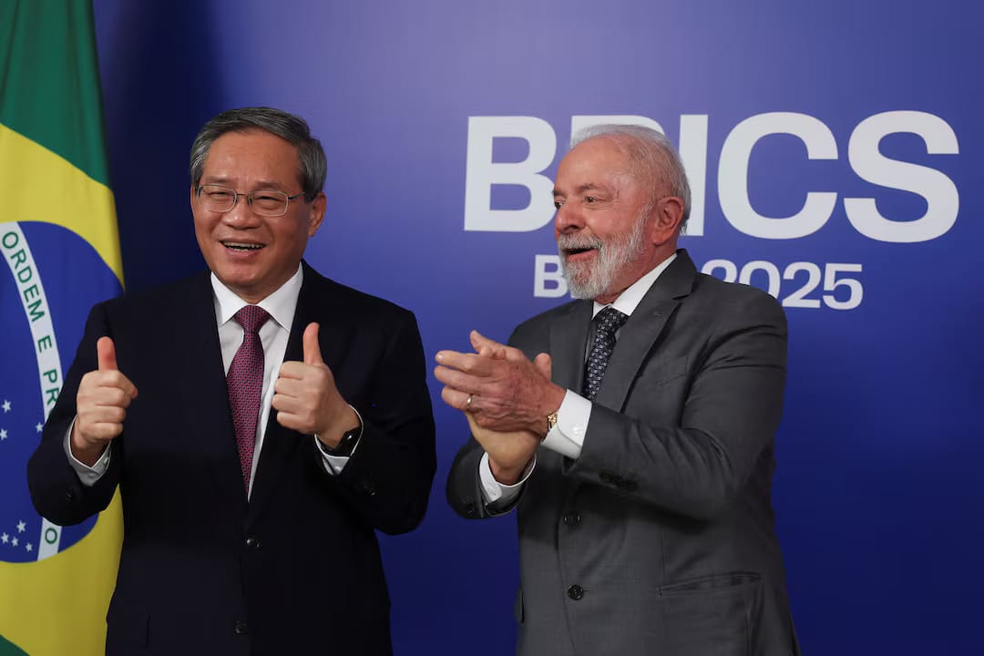 Officials and diplomats exchanging informal discussion outside the BRICS 2025 summit venue.