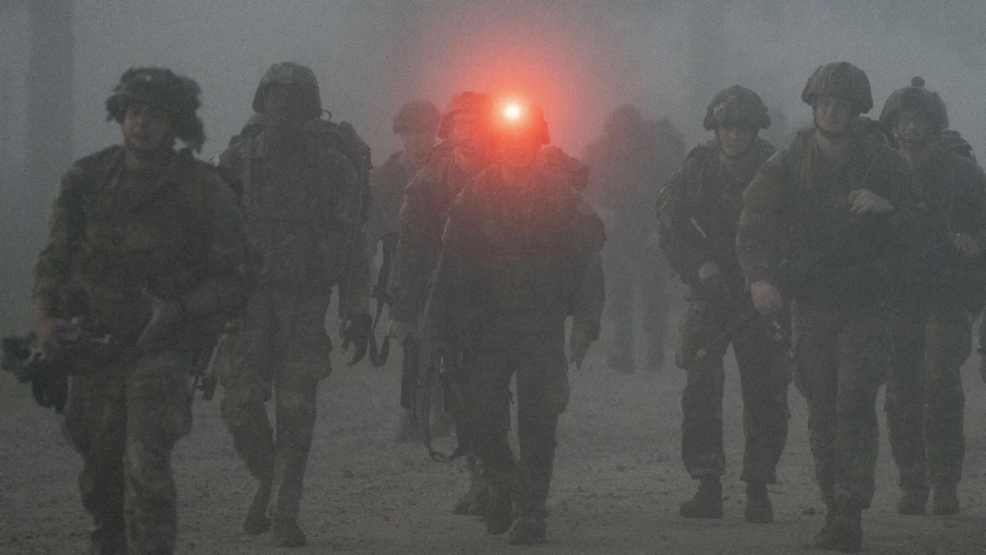 U.S. paratroopers during a ruck march, illustrating military training.