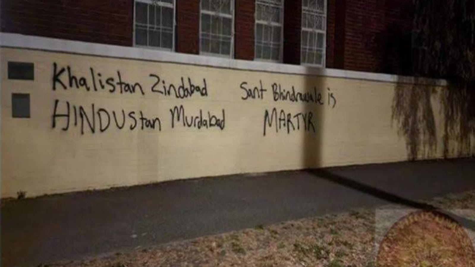 Temple wall sprayed with black slogans against India and calling for Khalistan.