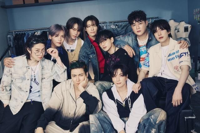 Super Junior members pose together in a casual yet stylish photoshoot.