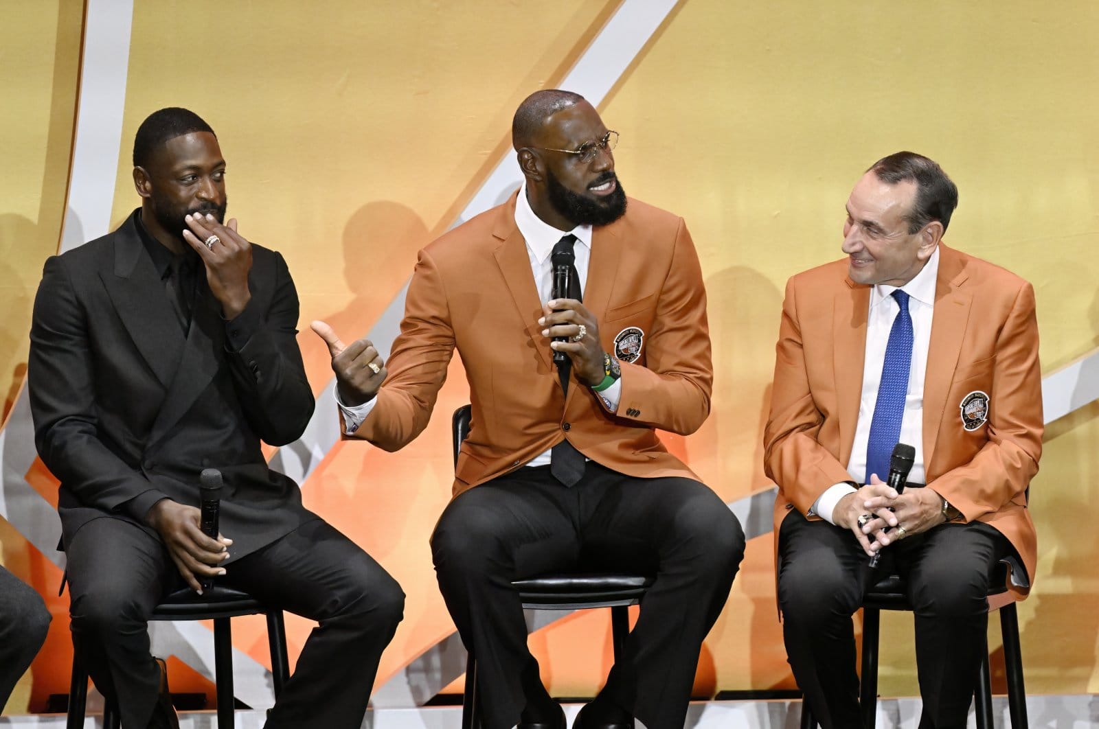 A press-style photo of LeBron James speaking publicly.
