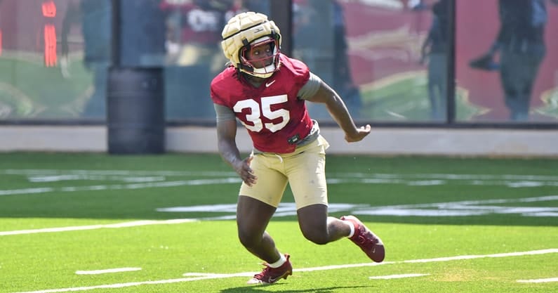 Picture of Pritchard in uniform executing a play.