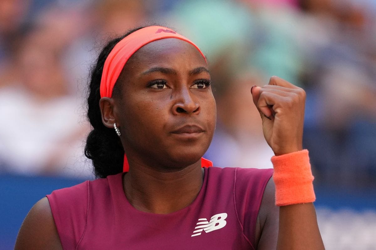 Coco Gauff pumps her fist in determination during a match at the US Open.