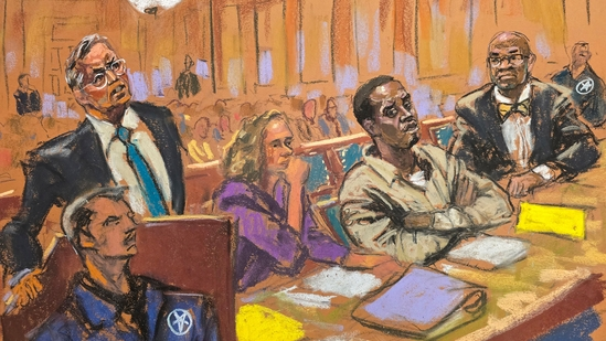 “Sean ‘Diddy’ Combs seated in a federal courtroom beside his legal team, listening as emotional testimony is delivered by former associates and accusers.”