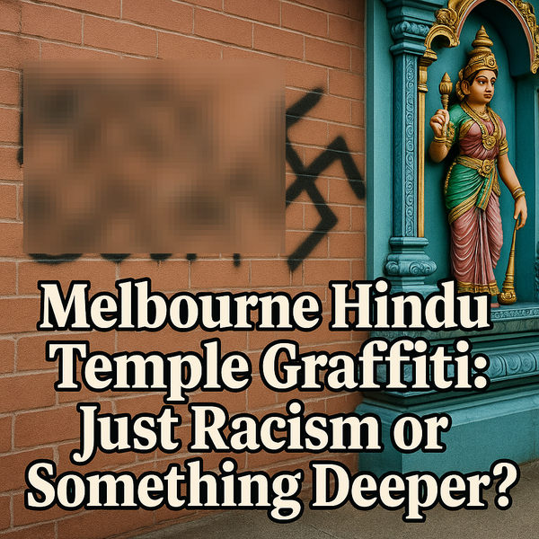 Graffiti with a swastika spray-painted on a Hindu temple wall in Melbourne next to a colorful deity statue.