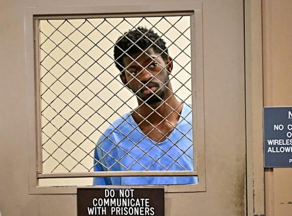 A photo of Lil Nas X through a jail visitation screen.