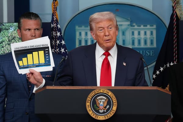 Former President Donald Trump speaking at a White House podium, holding up a chart titled “Juvenile Offenders in Crimes Against Persons,” with officials standing behind him.