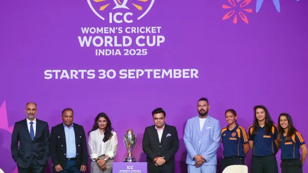 Officials and cricketers stand with the trophy during the launch of the ICC Women’s Cricket World Cup 2025 in India.
